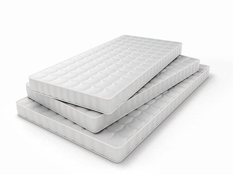 stack of mattresses of various sizes isolated on white backgroun